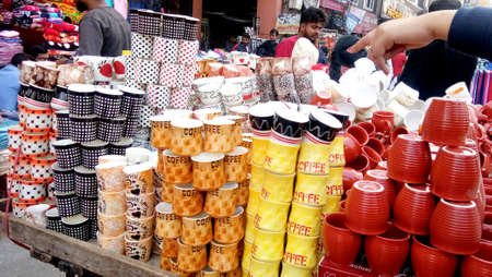 Lucknow, uttar pradesh, india, january 2020 : Variety of tea and coffee mugs for sale in asian marketのeditorial素材