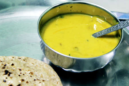 Indian Cuisine Kadhi - Vegetarian Curry Made of Buttermilk And Chick Pea Flour. served in a bowlの写真素材