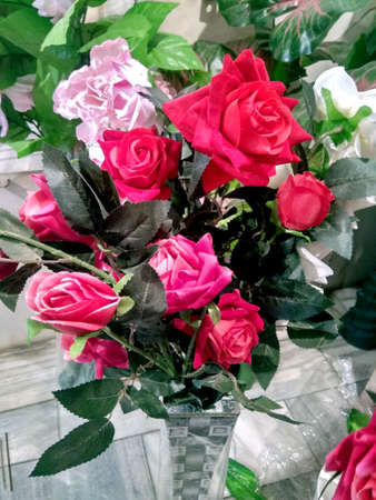 A bright and beautiful colors of plastic flowersの写真素材