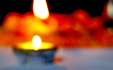 Diwali - an Indian festival of lights which is now celebrated all over the world. An abstract blurred background picture of diya oil lampの写真素材