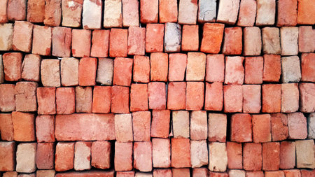Texture of old dark brown and red brick wall background