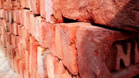Texture of old dark brown and red brick wall background