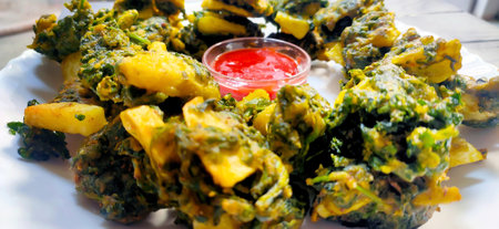 Spinach & potato Pakoras with sauce, An extremely delicious and mouth watering snack of Pakistani & Indian Peoplesの写真素材