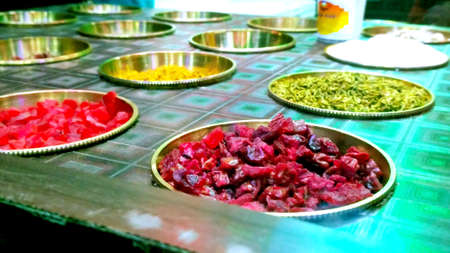 Ingredients of indian traditional meetha masala paan which is a mouth freshener and digestive. Sauf, tutti frutti, supari, clove, gulqand, coconut powder etc added in Betel leaves & chewed.の写真素材
