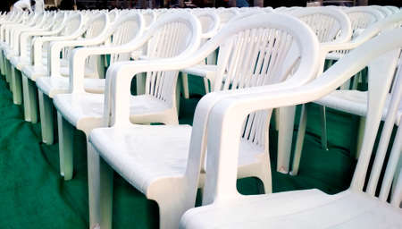 Rows of empty white chairs waiting for the audience in indiaの写真素材