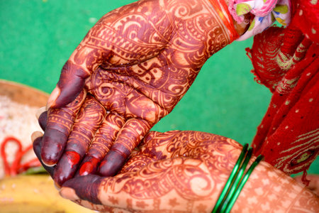 Indian bride showing hands mehndi design on weddingの写真素材