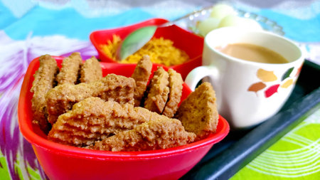 Tea and snacks with sweets for guests in indiaの写真素材
