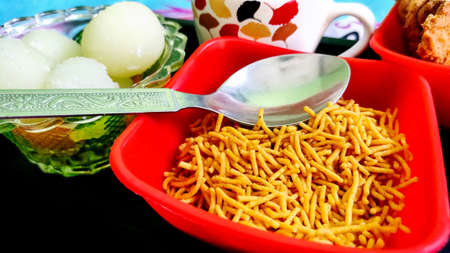 Tea and snacks with sweets for guests in indiaの写真素材