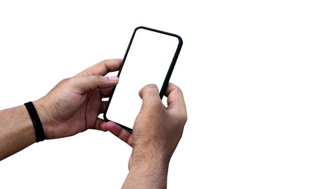 A man holding smartphone with blank screen on white background, closeup of hand. Space for textの写真素材