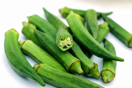 Raw okra or ladyfingers isolated on white backgroundの写真素材