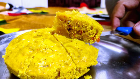 Handvo / handwa is a vegetable cake originating from the Gujarat, India.