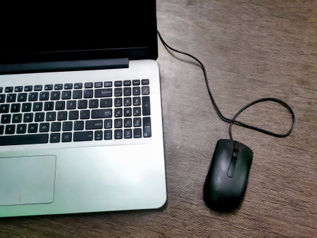 A Laptop keyboard, computer mouse. Working atmosphere on the table. Freelance. Business.の写真素材