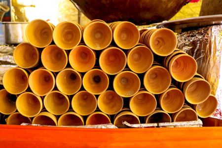 An Image of cups made of mud or sand called kulhad or kullhad used to serve authentic indian drinks called lassi, milk and teaの写真素材
