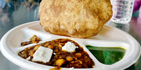 Chole bhature is a North Indian food dish. A combination of chana masala and bhatura or puri in...