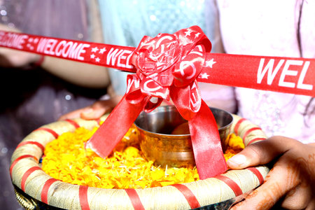 Cutting Ribbon in Indian Wedding Ritual Welcome Ceremonyの写真素材