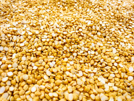 The photo showcases the texture and golden-yellow color of the lentils, commonly used in Indian...