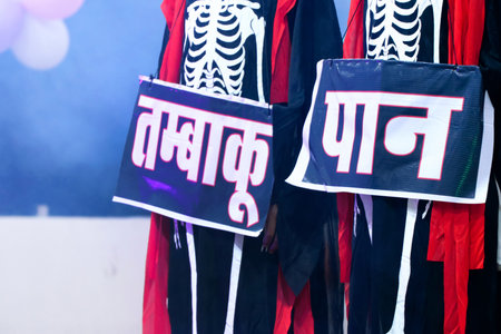 A powerful anti-addiction performance featuring actors dressed in skeleton costumes and scary masks to symbolize the deadly impact of substances like tobacco, betel, alcohol, drugs, and cigarettesの写真素材