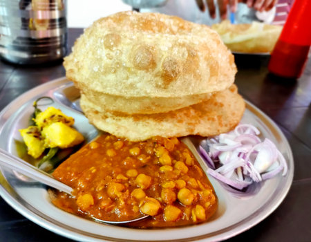 Chole bhature is a North Indian famous food dish. A combination of chana masala and bhatura or puri...