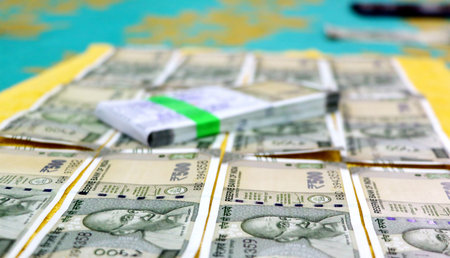 A closup of fanned out spread out Indian Rupees currency paper notes