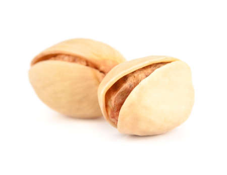 Pistachio nuts isolated on whiteの写真素材