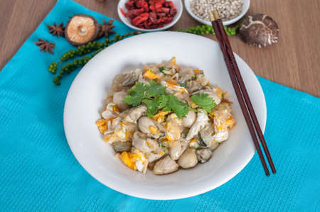 Braised oyster with eggs in white dish with background (shooting set menu) decorationの写真素材