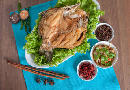 Fried sea perch topped with savory fish sauce menu with background (photo shooting set menu)の写真素材