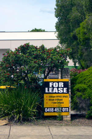 A For Lease Sign outside Offices in a tree and garden rich suburbの写真素材
