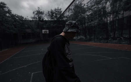 a dark man on the basketball courtの写真素材
