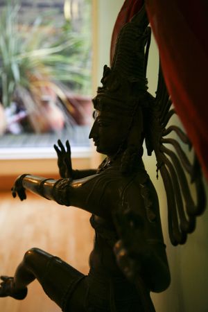 A hindu statue stands in an elegant roomの写真素材