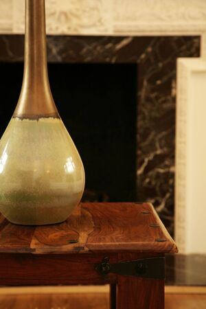 A vase on a wooden table topの写真素材