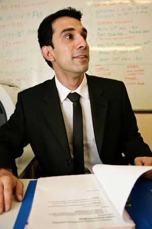 a worker checks some records for his bossの写真素材