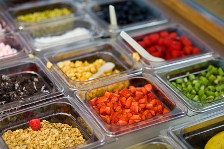 A selection of toppings in an ice cream parlourの写真素材