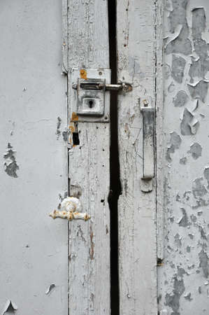 Latch and lock on painted old door の写真素材