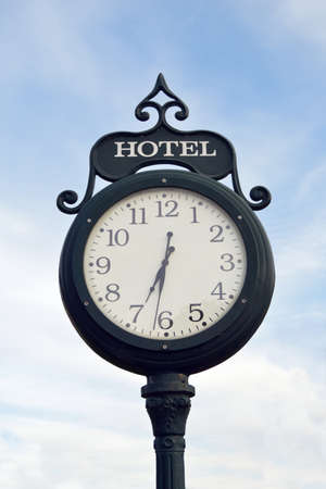 Clock with hotel sign in Victorian-styleの写真素材