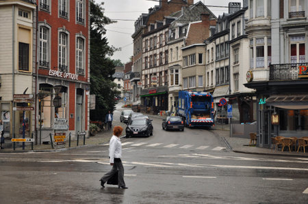 Spa, Belgium - August 2010   Municipal garbage collector and garbage compressor truck loading waste on the streets of Spaのeditorial素材