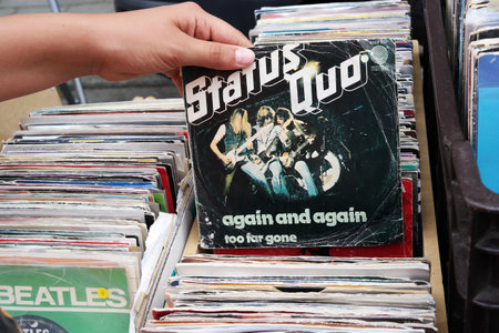 BELGIUM - JULY 2014  Single record of the English rock band Status Quo on a flea marketのeditorial素材