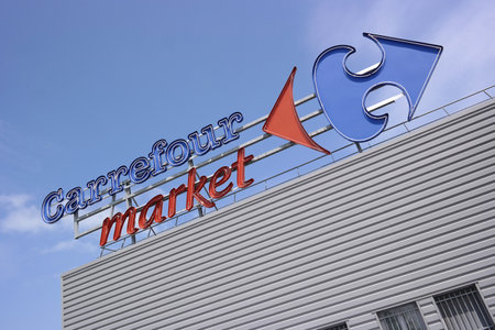 DUCEY, FRANCE - JULI 2014  Brand name on facade of a Carrefour market, Carrefour is a French multinational retailer, one of the largest supermarket chains in the worldのeditorial素材