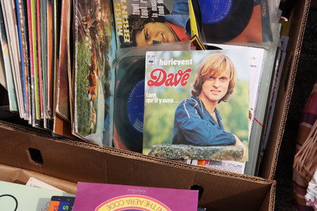 BELGIUM - JULY 2014 Single record of Dave a Francophone singer on a flea market.のeditorial素材
