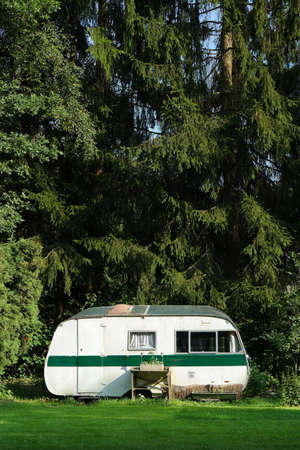 Outmoded travel trailer stationed for permanent in the Belgian Ardennes