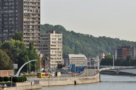 LIEGE, BELGIUM - AUGUST 2011: Boulevard Frere-Orban and Pond J.F. Kennedy. The Meuse river flowing through Liege, Belgiumのeditorial素材