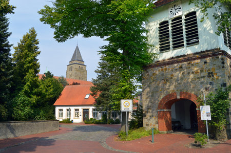 Clock tower and church tower of a German village Schapen in the Emsland districtのeditorial素材