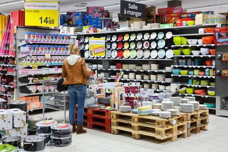 MALMEDY, BELGIUM - JULY 2015: Customer in the Household appliances section of a Carrefour Hypermarket, a French multinational retailer, and large hypermarket chain. MALMEDY, BELGIUM - JULY 2015: Customer in the Household appliances section of a Carrefour Hypermarket, a French multinational retailer, and large hypermarket chain.