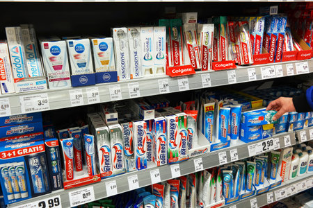 GERMANY - MARCH 2016: Variety of toothpaste fire on the shelves at the oral care department of a Rewe supermarket.のeditorial素材