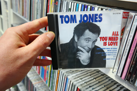 THE NETHERLANDS - APRIL 2016: Compilation CD record, All You Need Is Love, or the Welsh pop singer Tom Jones in a second hand store.のeditorial素材