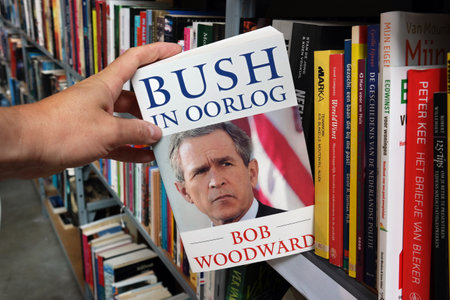 THE NETHERLANDS - JULY 2016: Bush at War, Dutch version of Bush at War, book by Washington Post reporter Bob Woodward in a Dutch second hand store.のeditorial素材