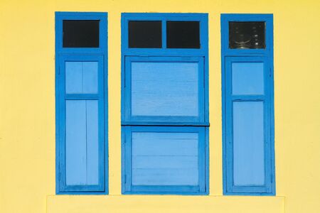 Window, yellow and blue of a beautiful building in Thailandの写真素材