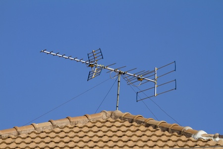 Antenna on the roof, brown sunny day の写真素材