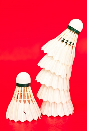 Flounce for game in badminton on a red backgroundの写真素材