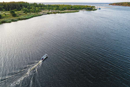 View from above, stunning aerial view of sailing white luxury modern not big sail boat or yacht at...