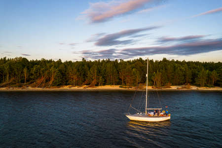 View from above, stunning aerial view of sailing white luxury modern not big sail boat or yacht with...